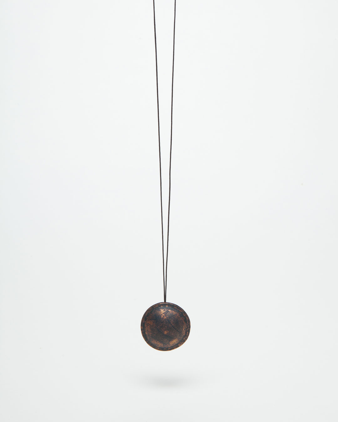 Nicole Beck, Middle One, 2016, pendant; copper, enamel, string, ø 40 mm, €300