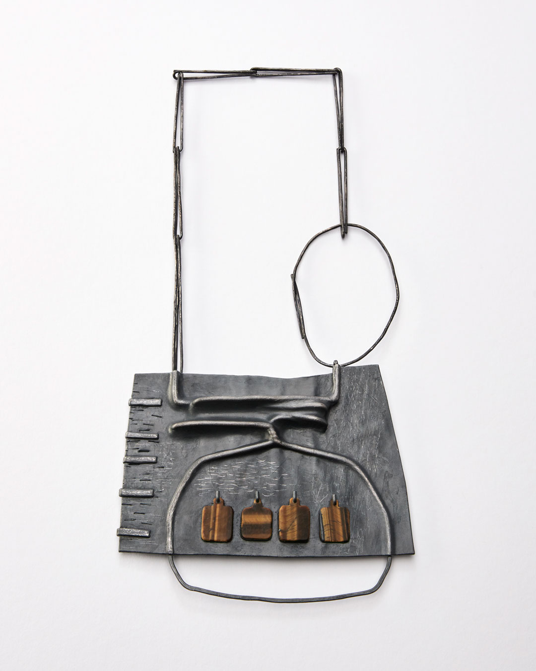 Iris Bodemer, Klang 3 (Sound 3), 2019, pendant; silver, thermoplastic, tiger's eye, 110 x 135 x 10 mm, €4250