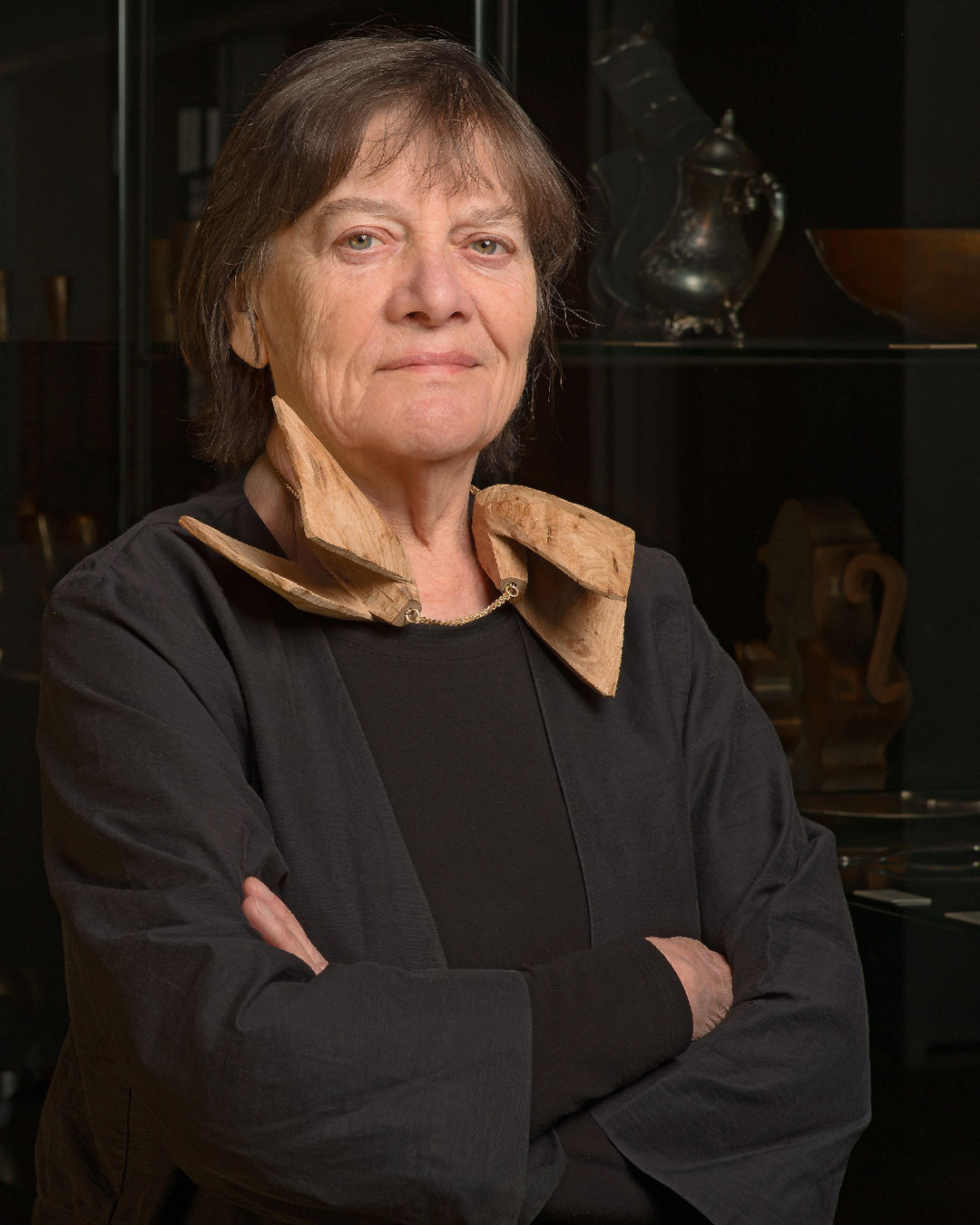 Marie-José van den Hout wearing Dorothea Prühl's necklace Two Large Birds, 2020, elm wood and gold, price on request
